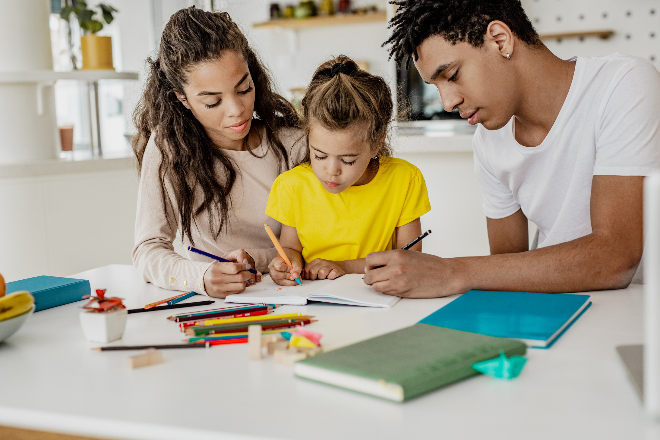 Young parents homeschooling their child